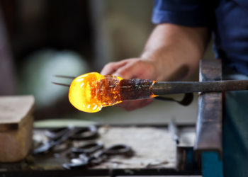 Glass blower forming beautiful piece of glass, Murano, Venice, Italy